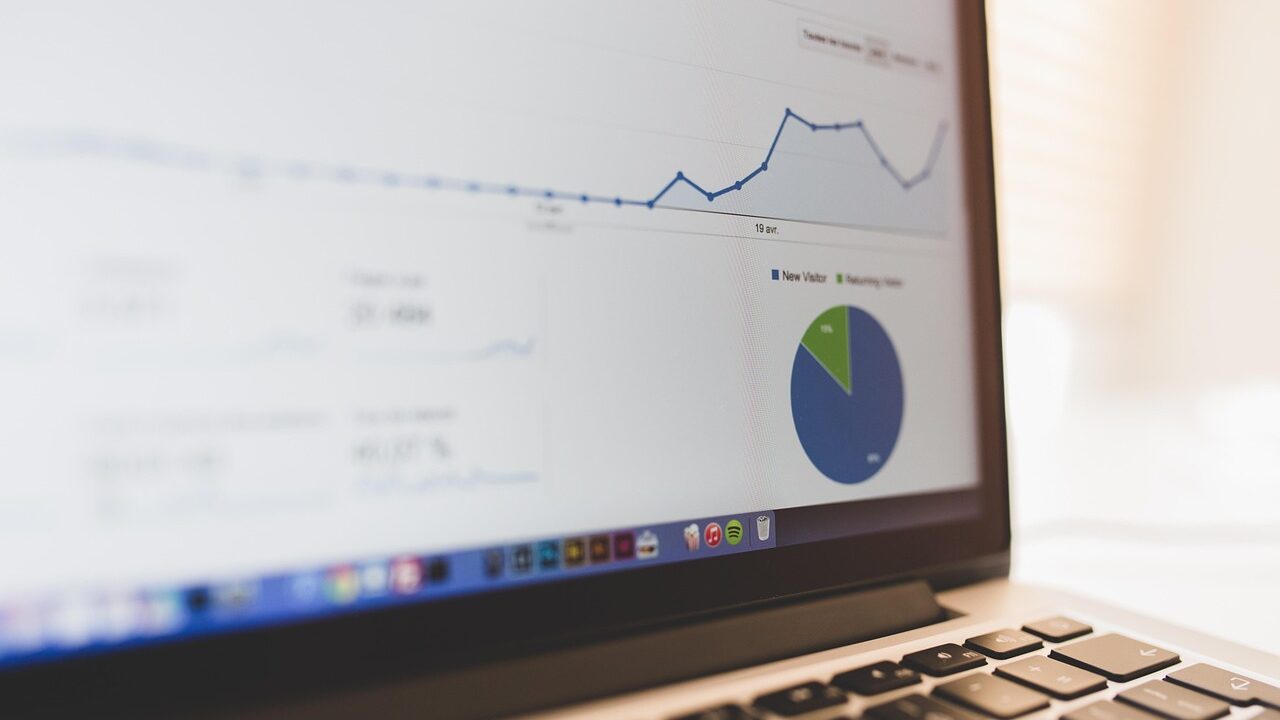 Business analyst working with data enrichment tools on a computer