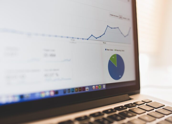 Business analyst working with data enrichment tools on a computer