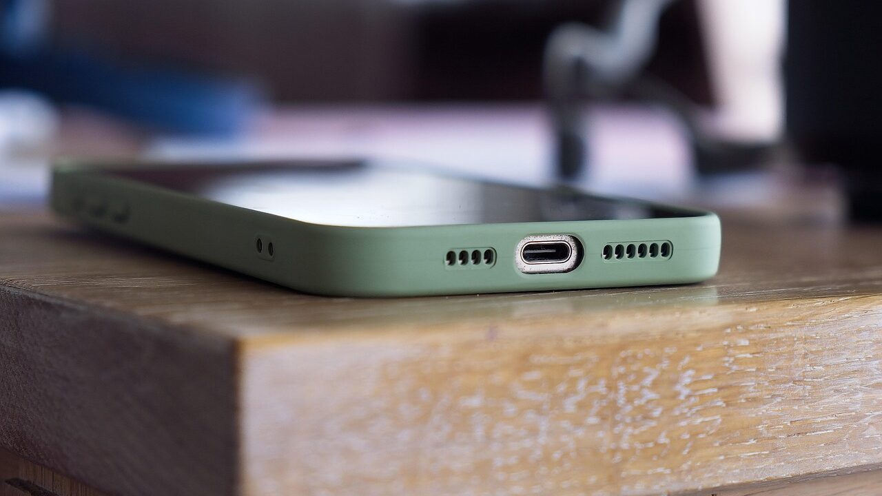Close-up of an older iPhone with performance indicators
