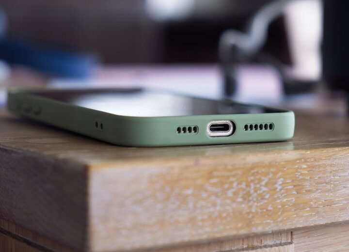 Close-up of an older iPhone with performance indicators
